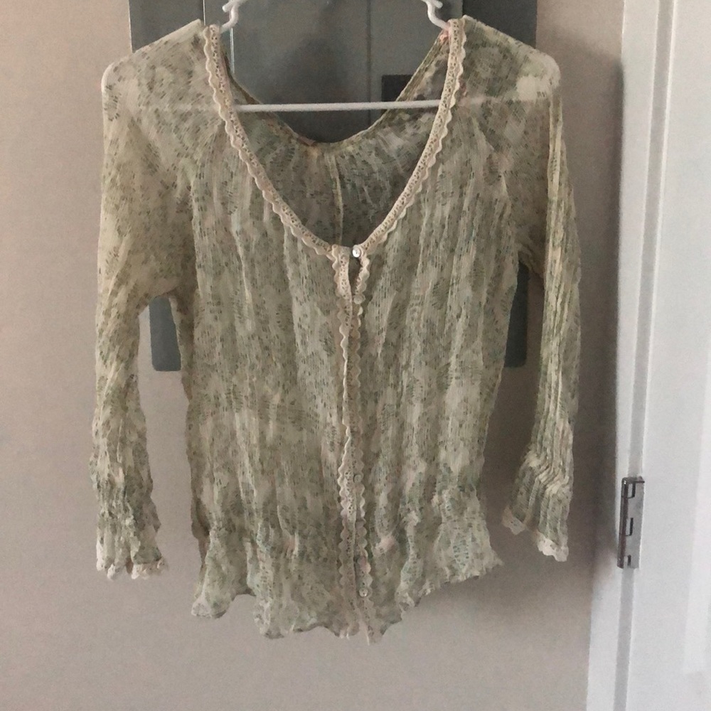 Lacey, ruched light green top.